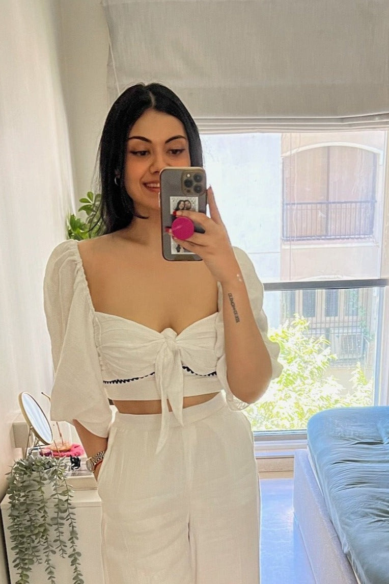 Bow top in cotton with wave trim detail under the bust